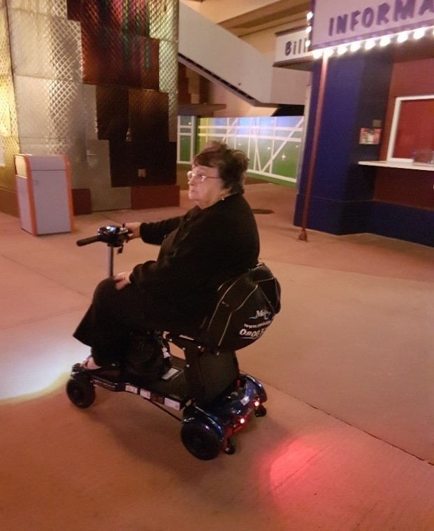 Lady riding her i3 mobility scooter around Disneyland Paris Lady riding her i3 mobility scooter around Disneyland Paris